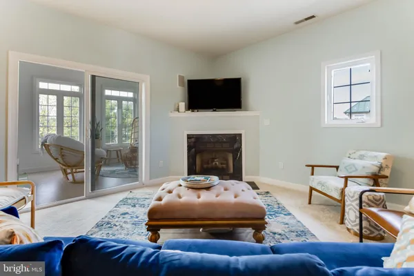 a bedroom with a bed a couch and dresser