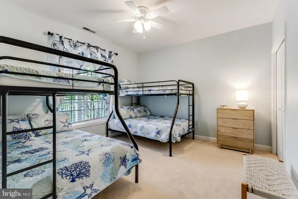 a bedroom with bed and a window