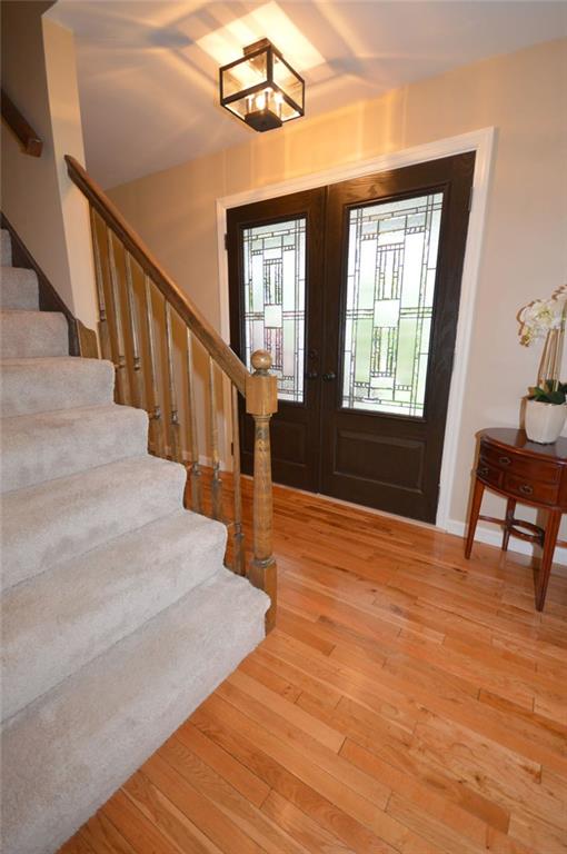 Classic hardwood, updated lighting and gorgeous updated double doors greet you in the entry hall.
