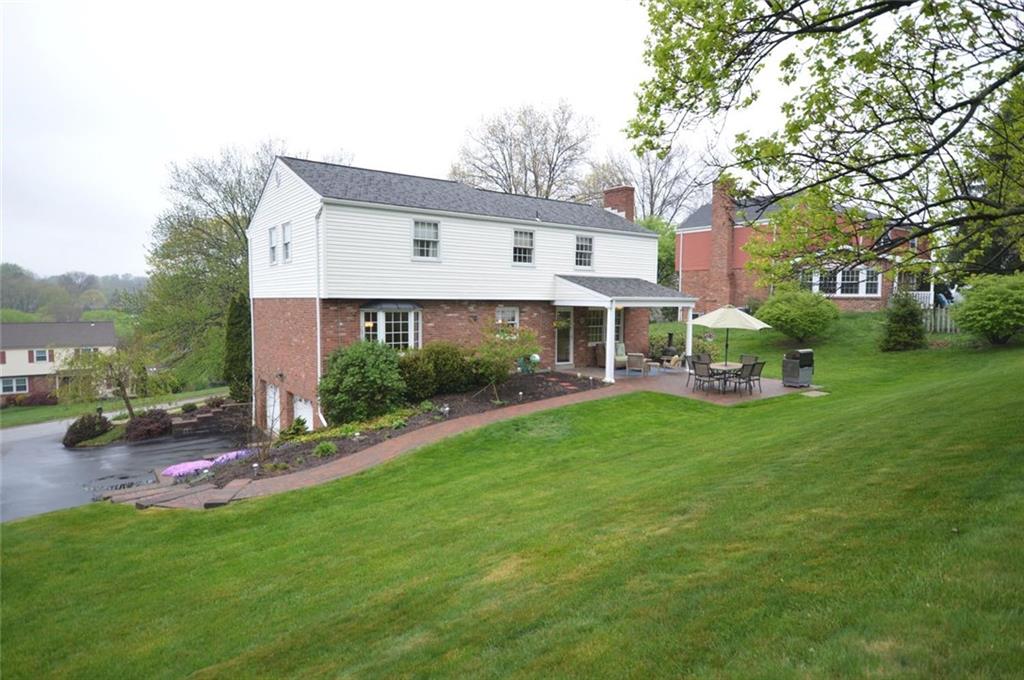 107 Yorktown Road Canonsburg, PA 15317 - Photo 25 of 25 Amazing outdoor space! You'll have both covered and open patio areas, lush landscaping and built-in garden boxes for vegetables or flowers to cut! The walkway to the driveway is an easy way for guests to arrive.