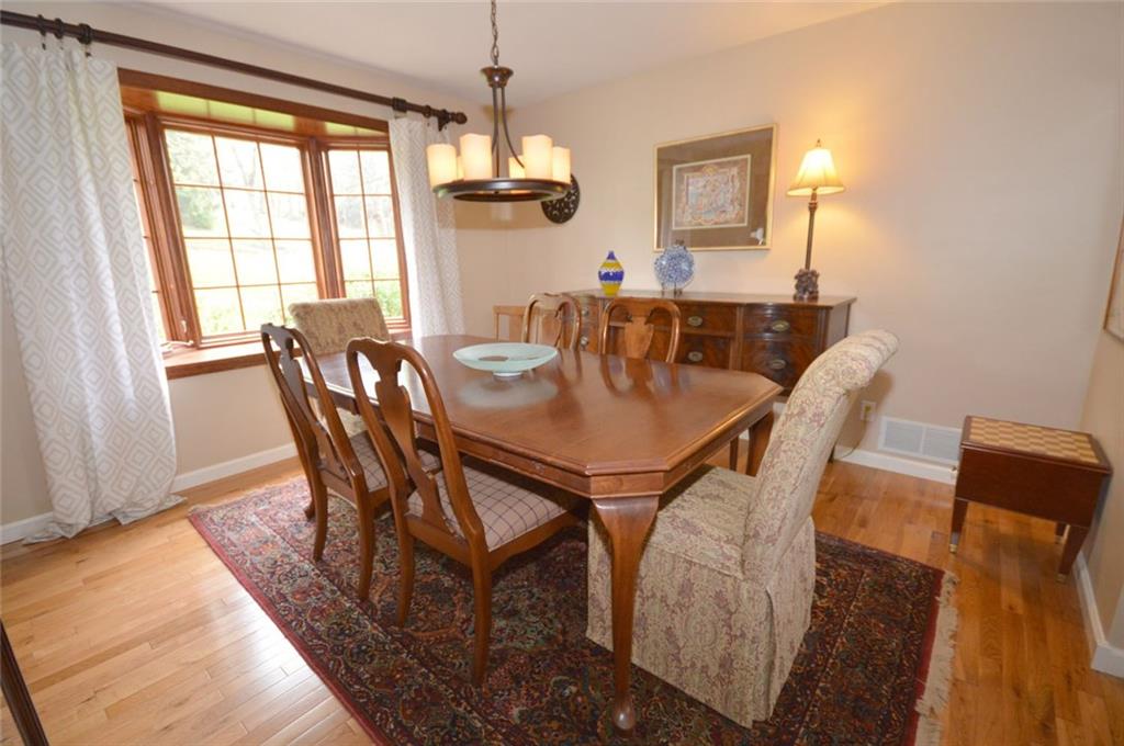 The perfect dining room for formal entertaining - the bay window overlooks the lush rear yard