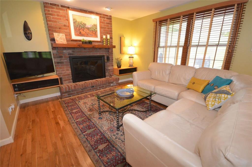107 Yorktown Road Canonsburg, PA 15317 - Photo 10 of 25 The first floor family room features a log burning fireplace, built-in shelving and a double window to let in light!