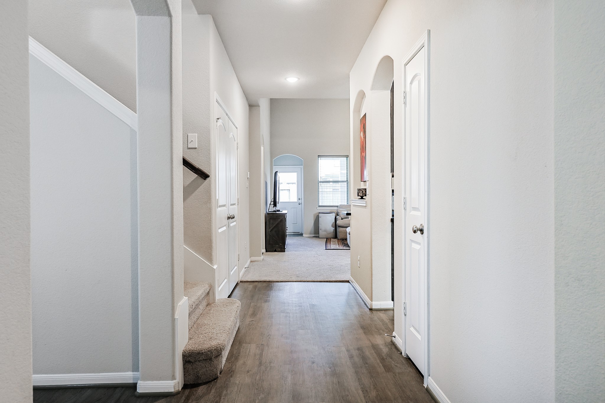 10423 Rochester Hls Lane Tomball, TX 77375 - Photo 4 of 36 Step inside and be greeted by a long, elegant foyer that sets a sophisticated tone for the rest of this beautiful home.