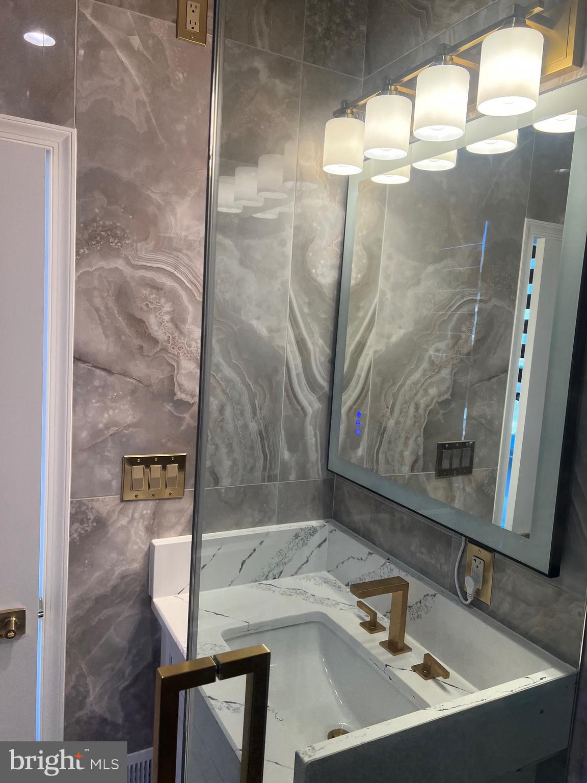 6063 Soho Way Hyattsville, MD 20782 - Photo 11 of 16 a bathroom with a sink and a mirror