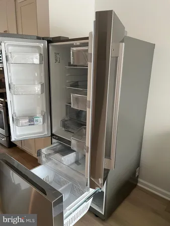 a view of a refrigerator in kitchen