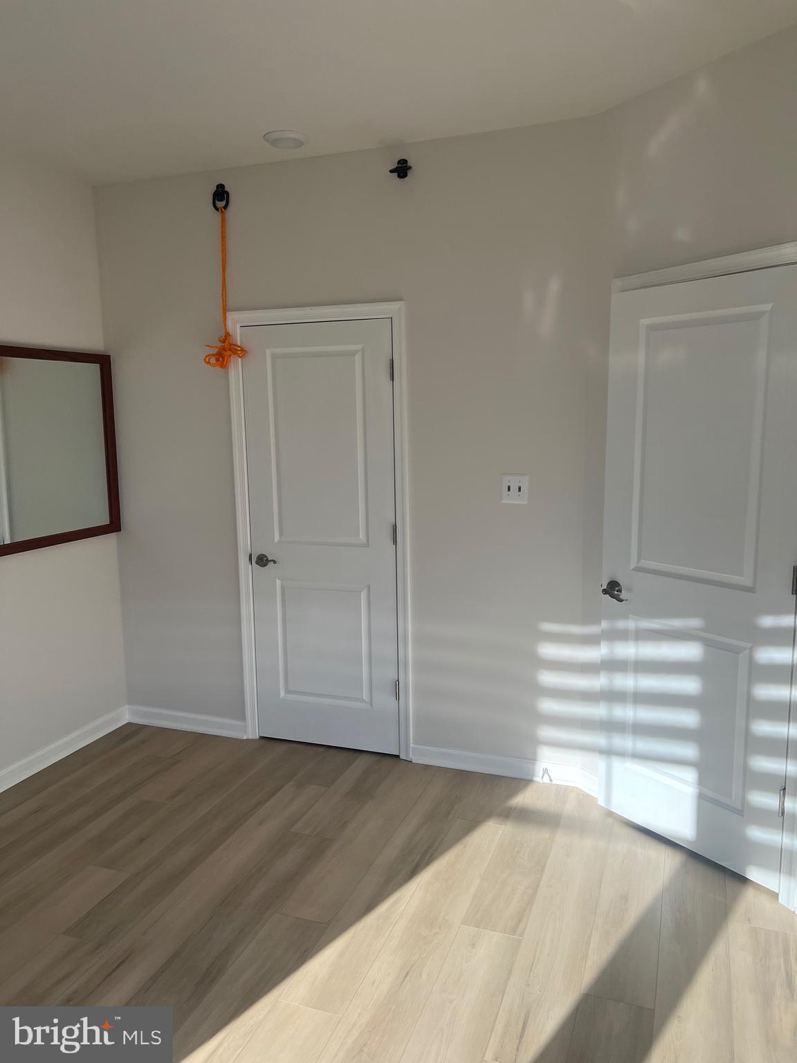 6063 Soho Way Hyattsville, MD 20782 - Photo 8 of 16 a view of empty room with wooden floor