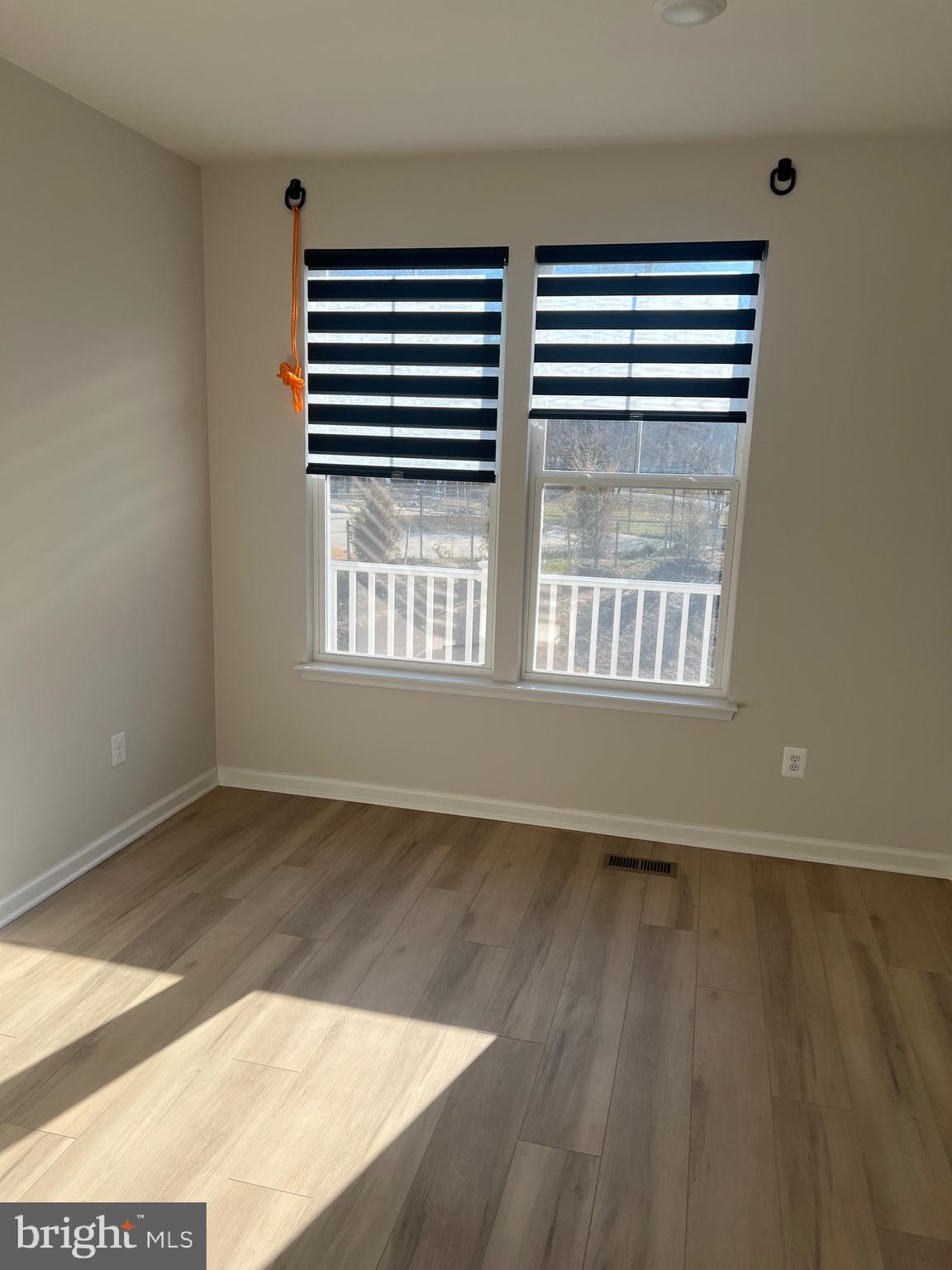 6063 Soho Way Hyattsville, MD 20782 - Photo 9 of 16 an empty room with wooden floor