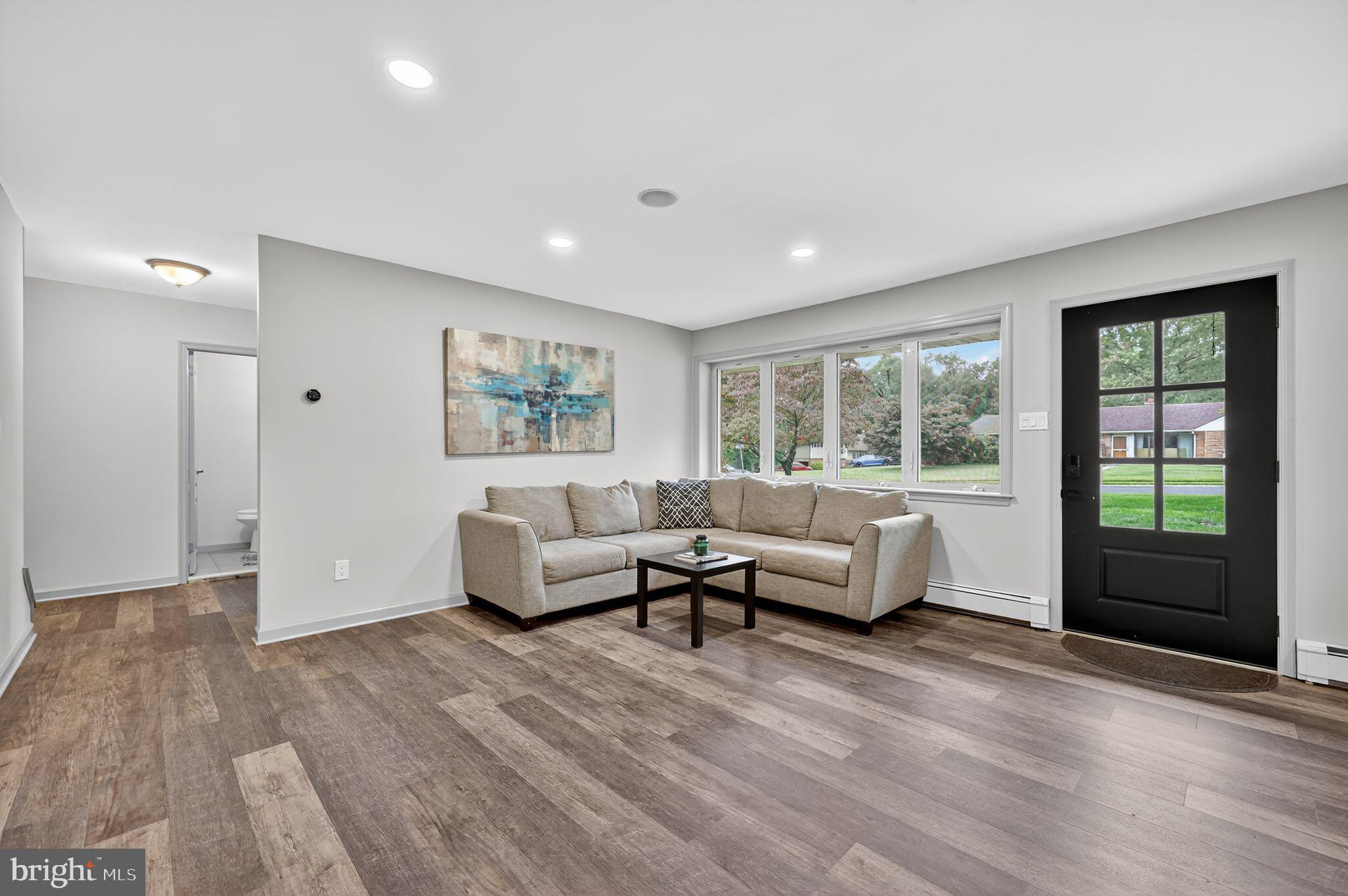 657 Pembroke Road Rydal, PA 19046 - Photo 11 of 36 a living room with furniture and windows
