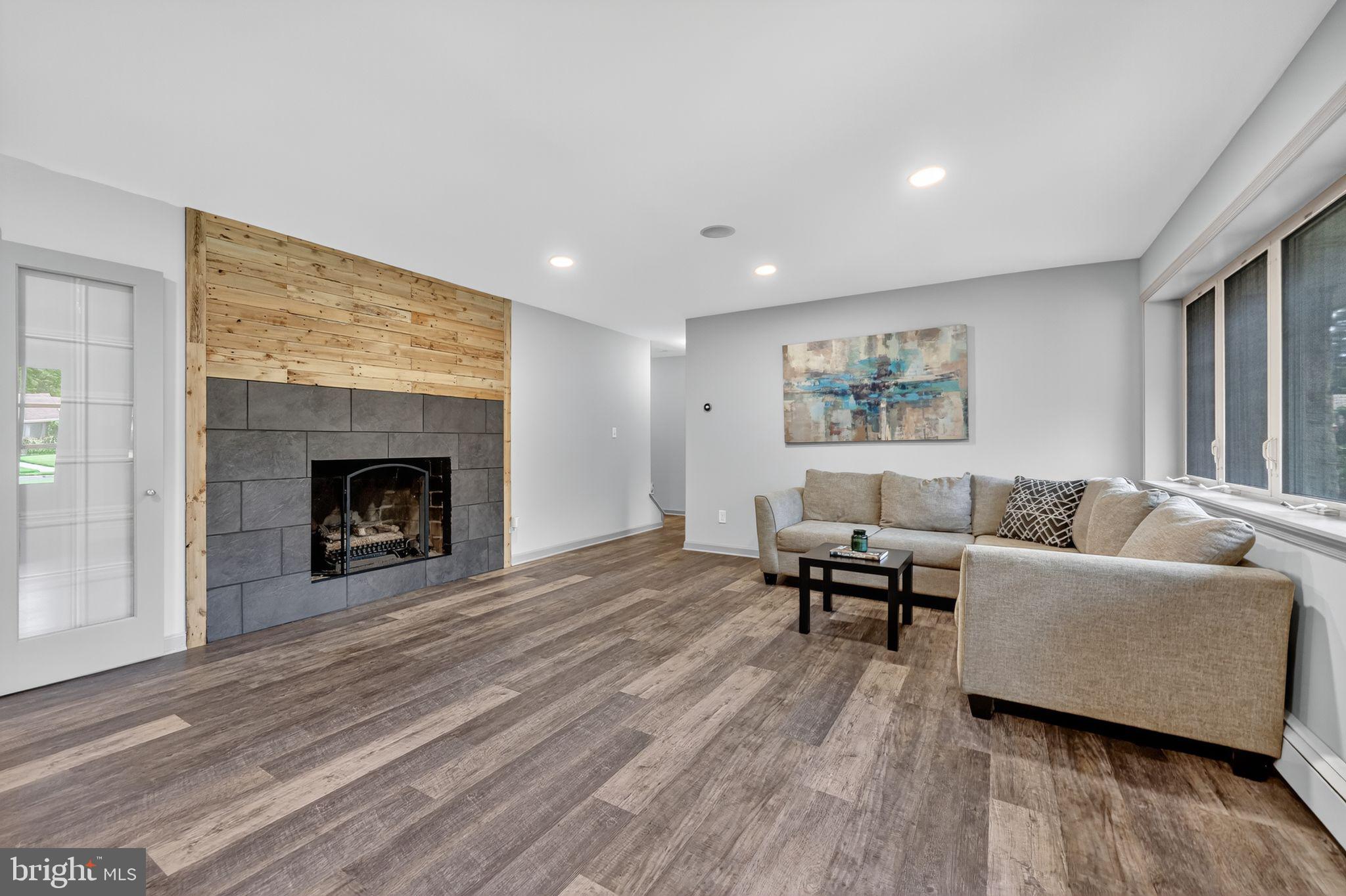 657 Pembroke Road Rydal, PA 19046 - Photo 13 of 36 a living room with furniture and a fireplace