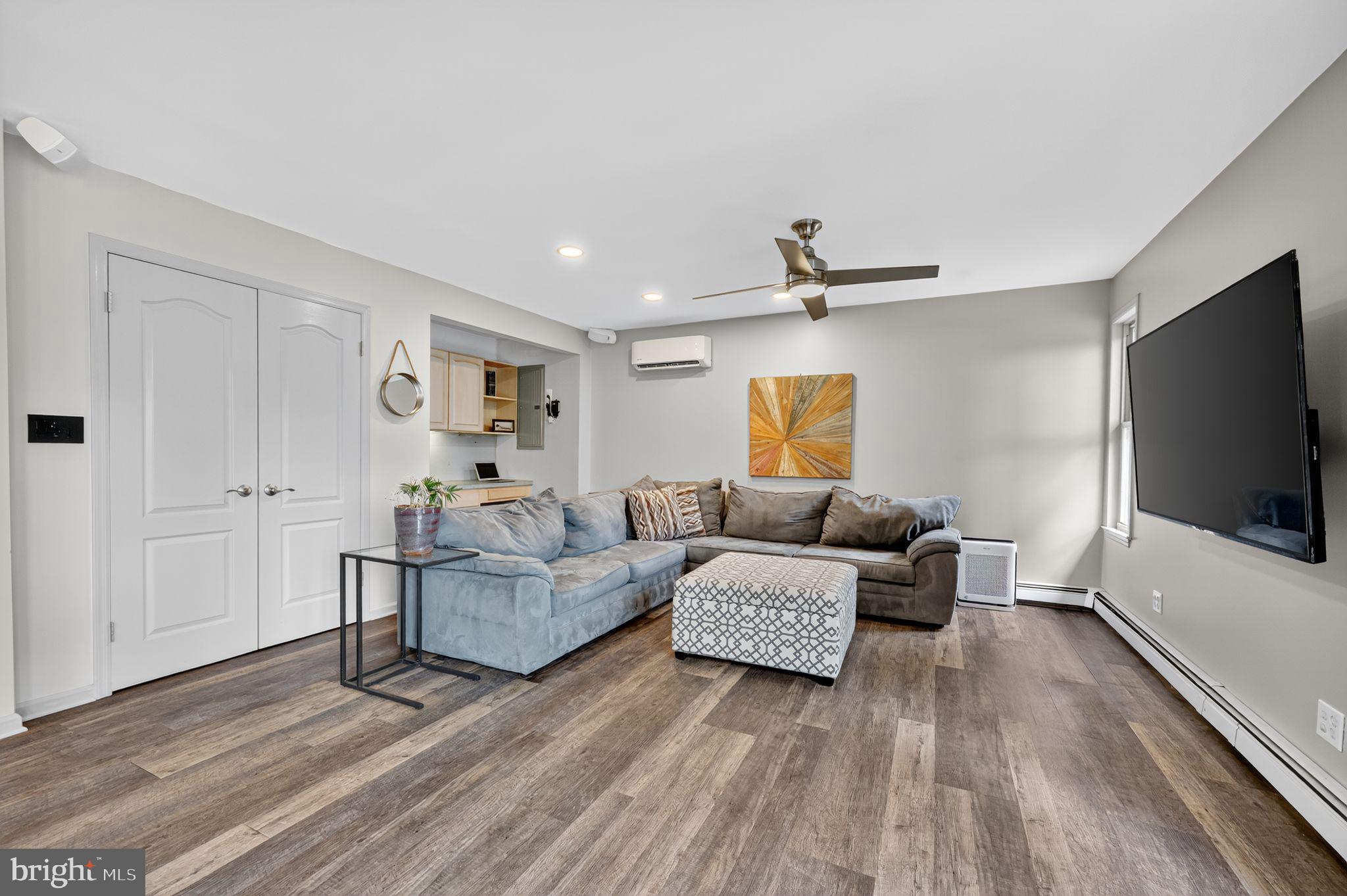 657 Pembroke Road Rydal, PA 19046 - Photo 18 of 36 a living room with furniture and a flat screen tv