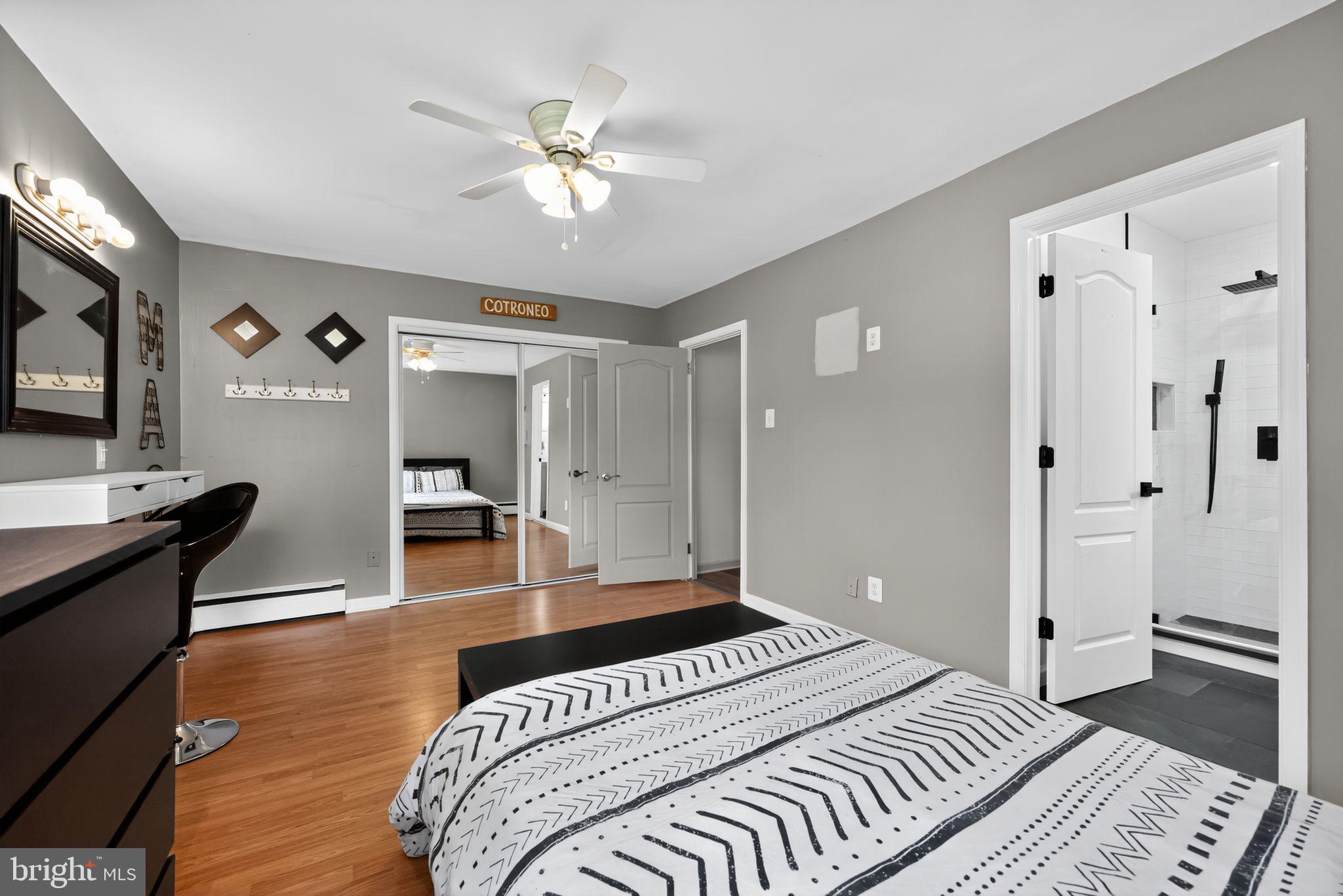 657 Pembroke Road Rydal, PA 19046 - Photo 21 of 36 a bedroom with a bed and a chandelier