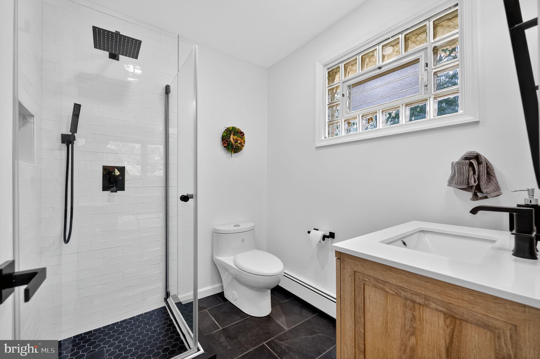 657 Pembroke Road Rydal, PA 19046 - Photo 23 of 36 a bathroom with a sink toilet and shower