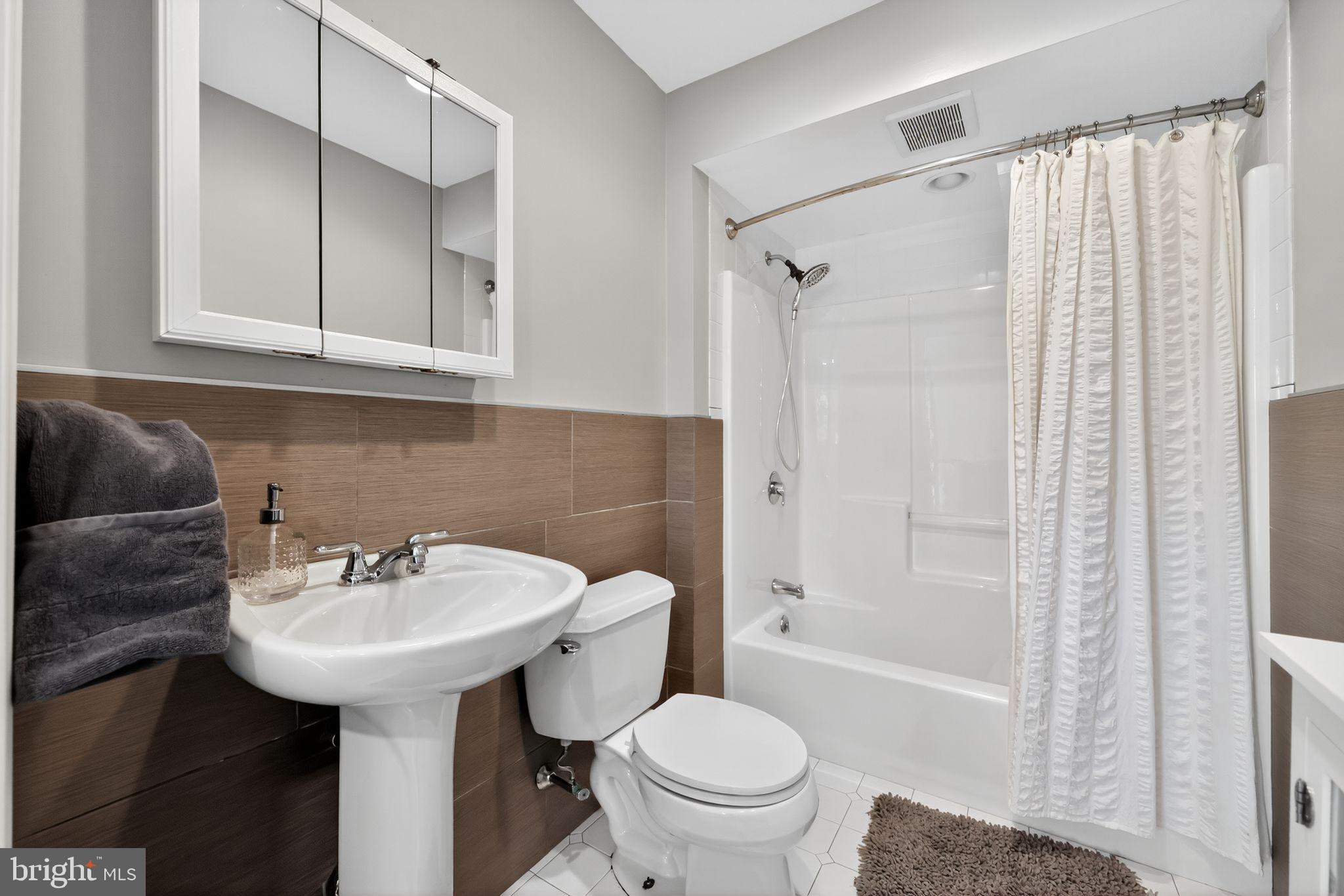 657 Pembroke Road Rydal, PA 19046 - Photo 24 of 36 a bathroom with a sink toilet and shower