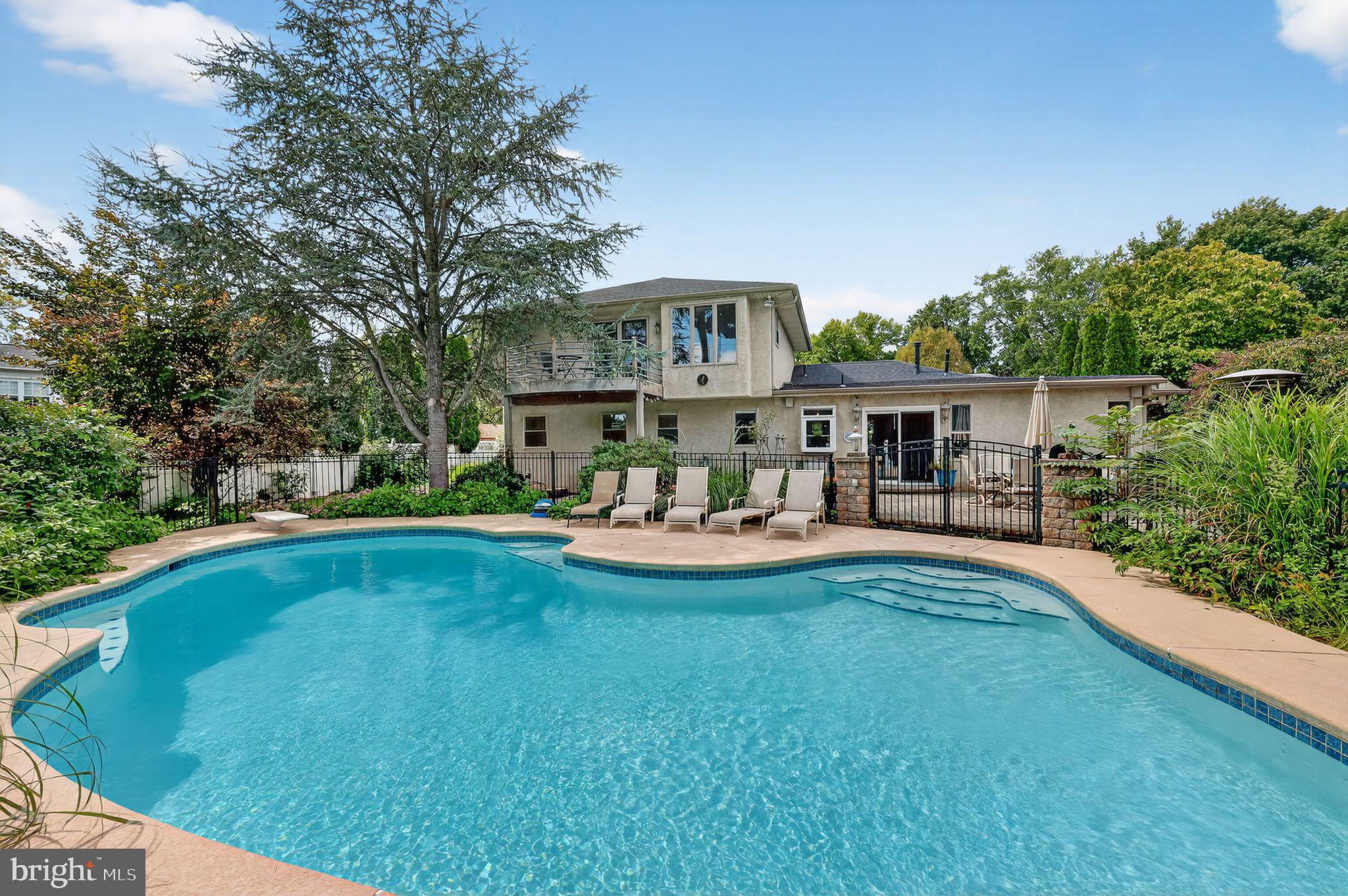 657 Pembroke Road Rydal, PA 19046 - Photo 6 of 36 a view of a house with swimming pool and sitting area