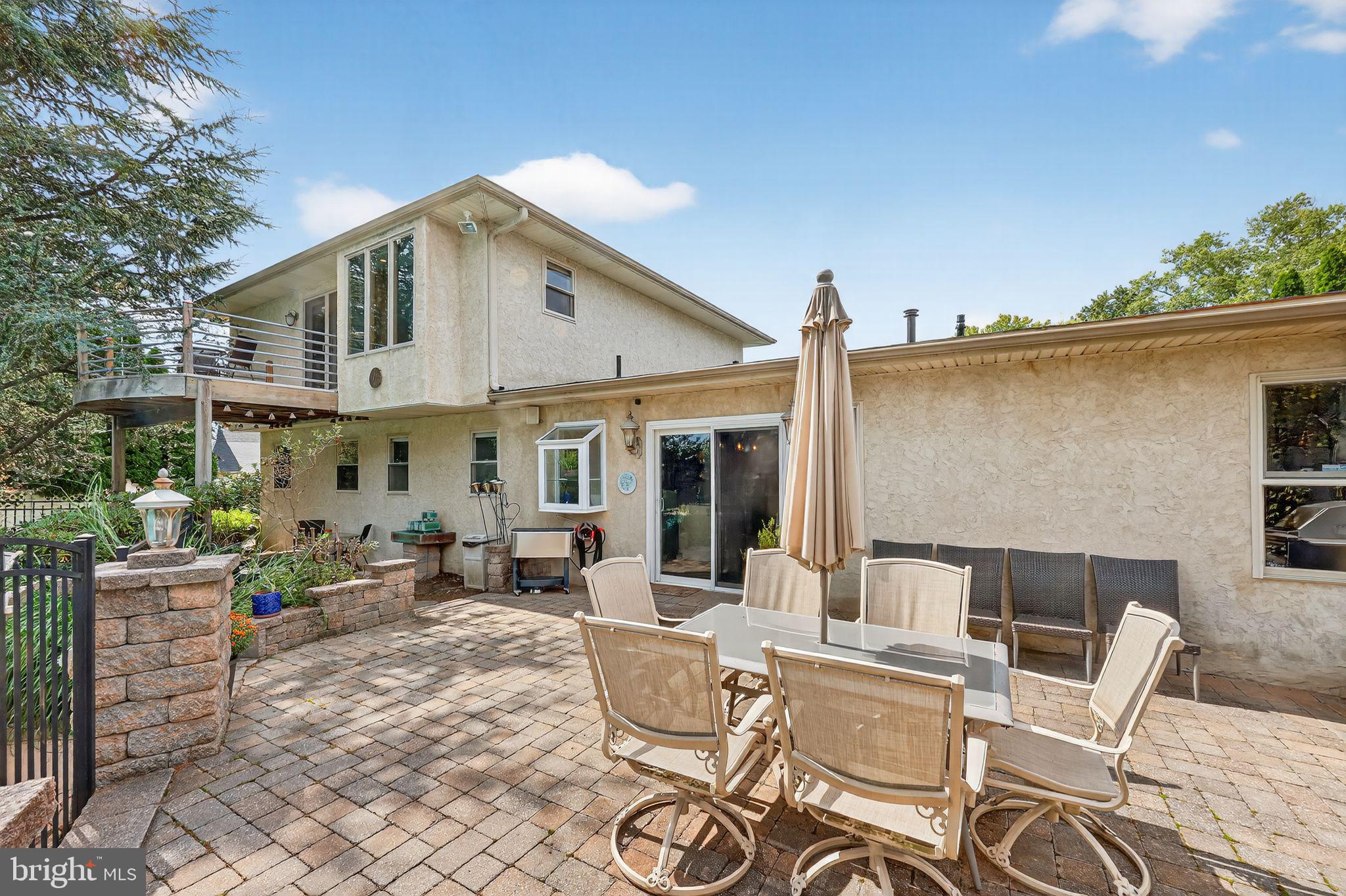 657 Pembroke Road Rydal, PA 19046 - Photo 9 of 36 a view of a patio with couches chairs and potted plants