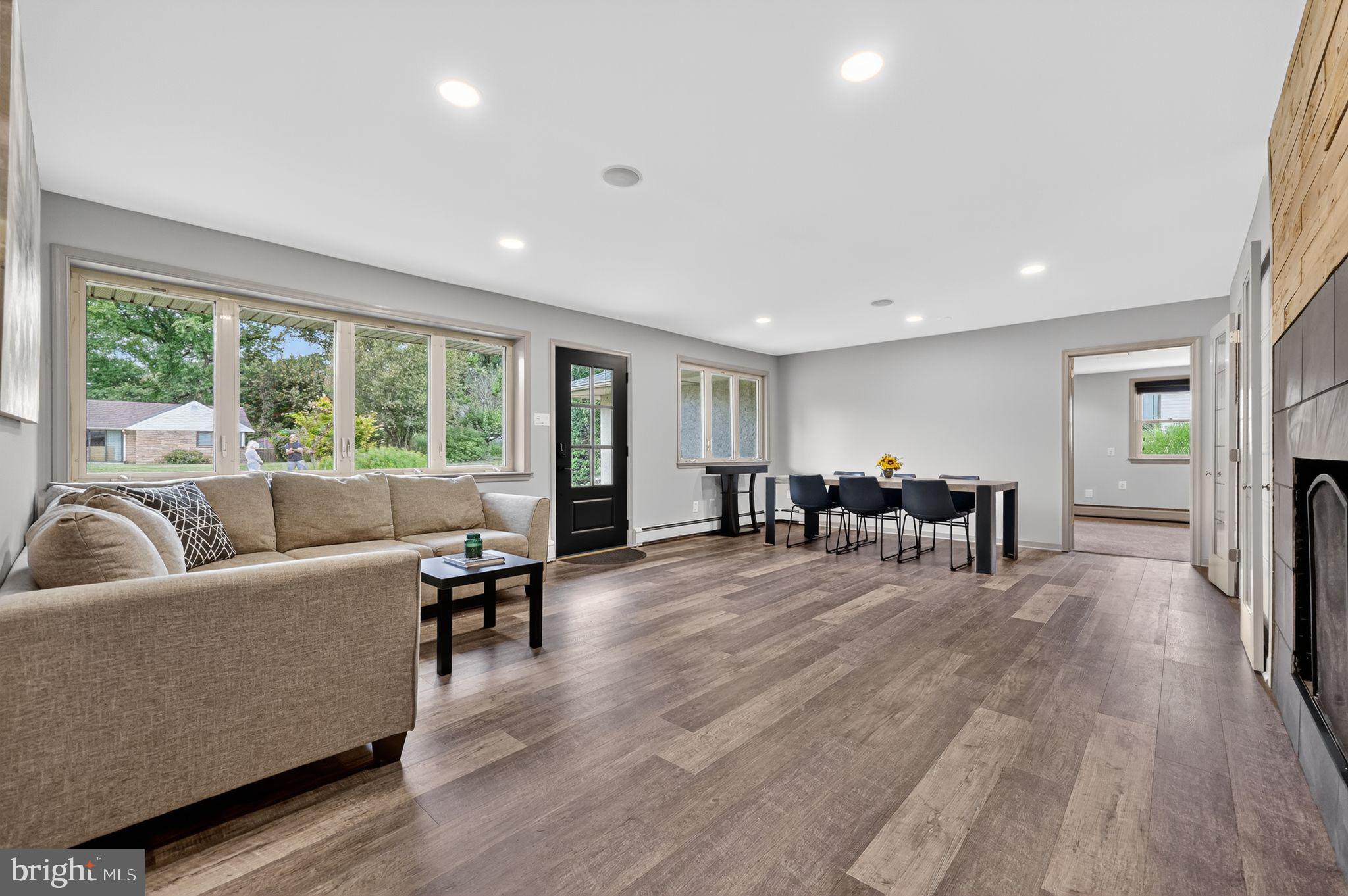 657 Pembroke Road Rydal, PA 19046 - Photo 10 of 36 a living room with furniture and large windows
