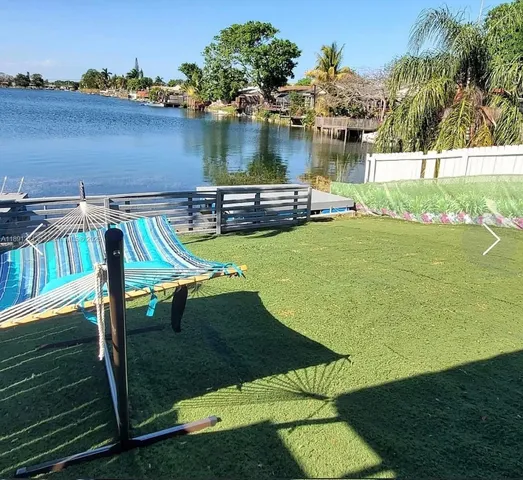 swimming pool view with a seating space