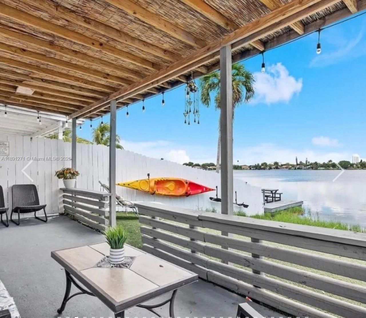 2421 Southwest 58th Manor, Unit 1 Dania Beach, FL 33312 - Photo 2 of 15 a view of a terrace with furniture