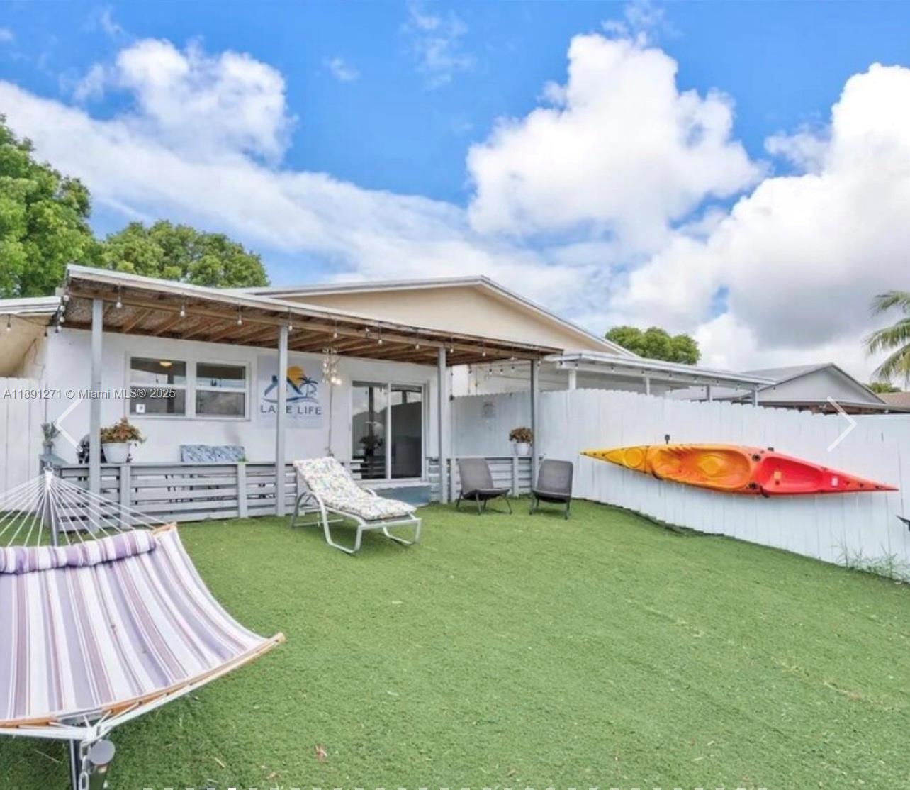 2421 Southwest 58th Manor, Unit 1 Dania Beach, FL 33312 - Photo 3 of 15 a view of a house with swimming pool and porch