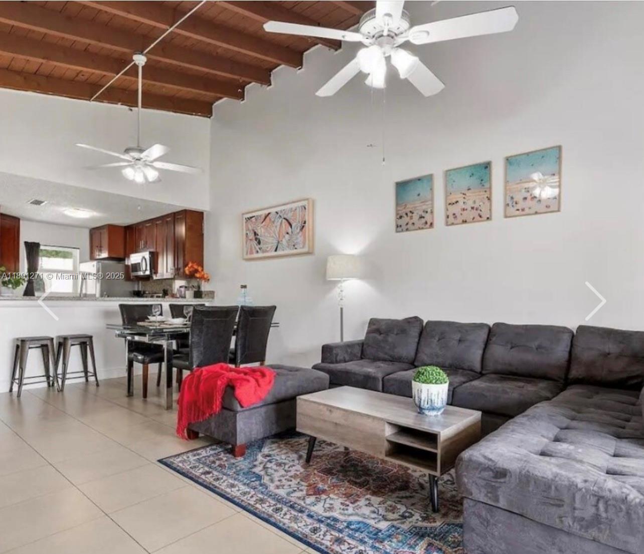 2421 Southwest 58th Manor, Unit 1 Dania Beach, FL 33312 - Photo 7 of 15 a living room with furniture and kitchen view