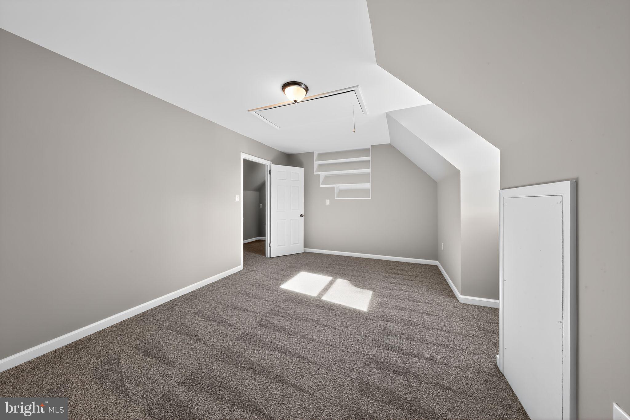 261 West Main Street Elkton, MD 21921 - Photo 28 of 31 a view of an empty room with wooden floor and a ceiling fan