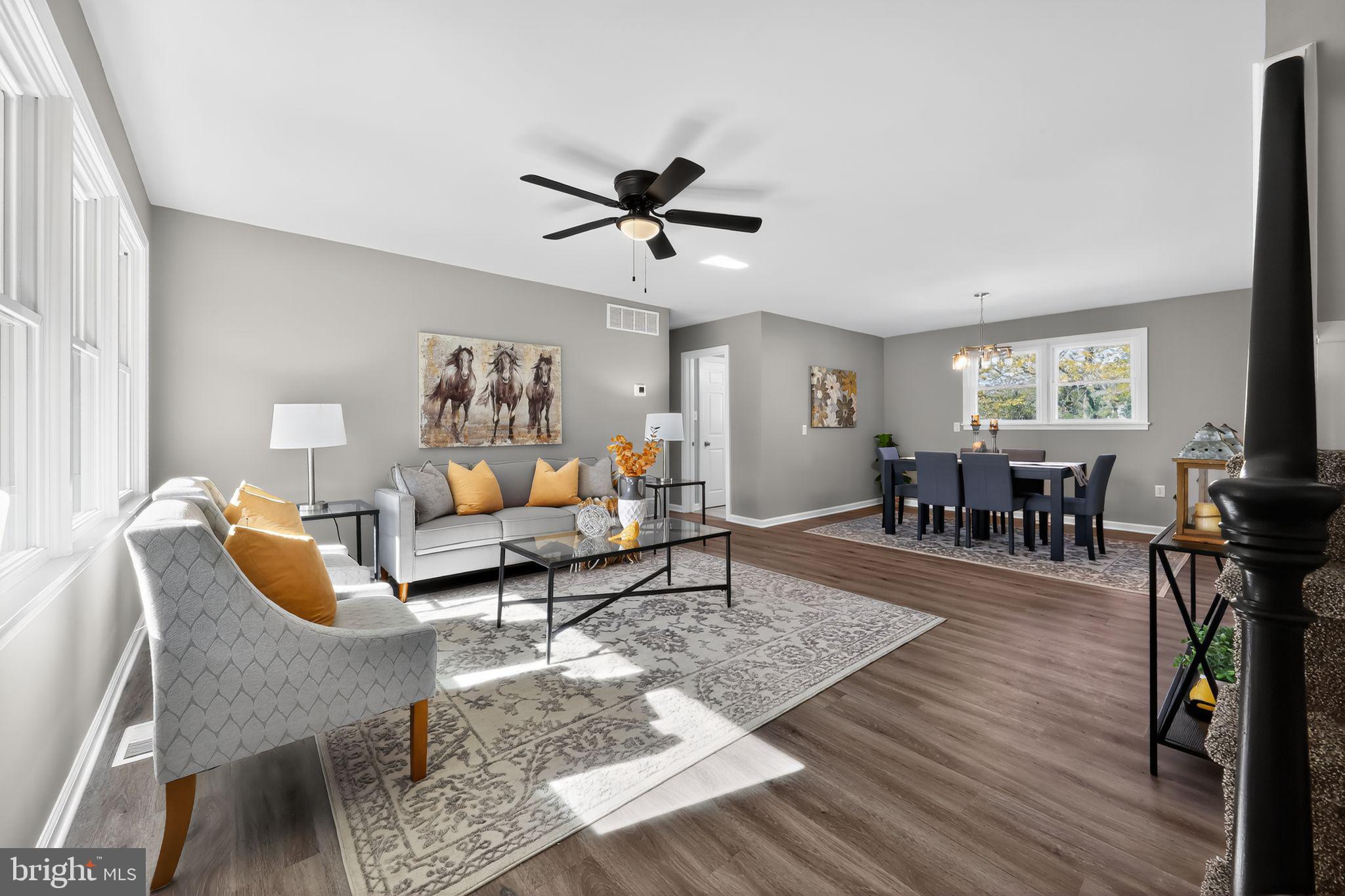 261 West Main Street Elkton, MD 21921 - Photo 8 of 31 a living room with furniture a wooden floor and a window