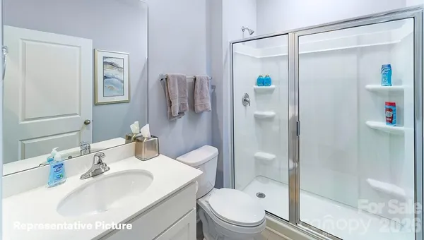 a white toilet sitting next to a bath tub