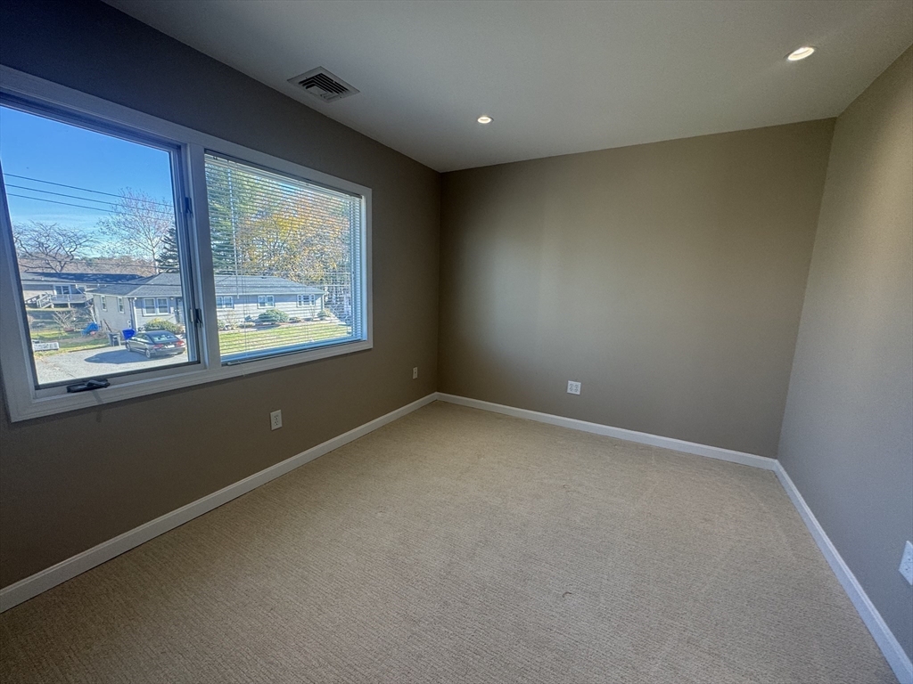 39 Neillian Street, Unit 39 Bedford, MA 01730 - Photo 20 of 29 an empty room with windows
