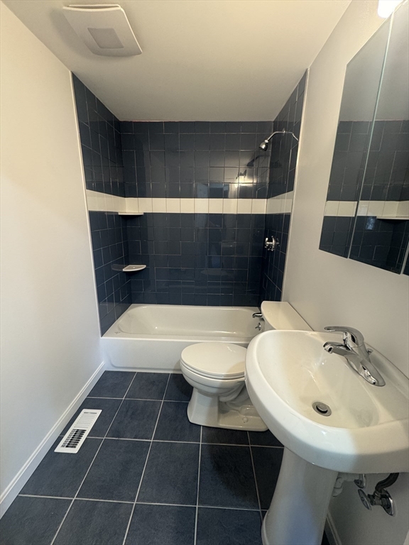 39 Neillian Street, Unit 39 Bedford, MA 01730 - Photo 23 of 29 a bathroom with a sink a toilet and shower