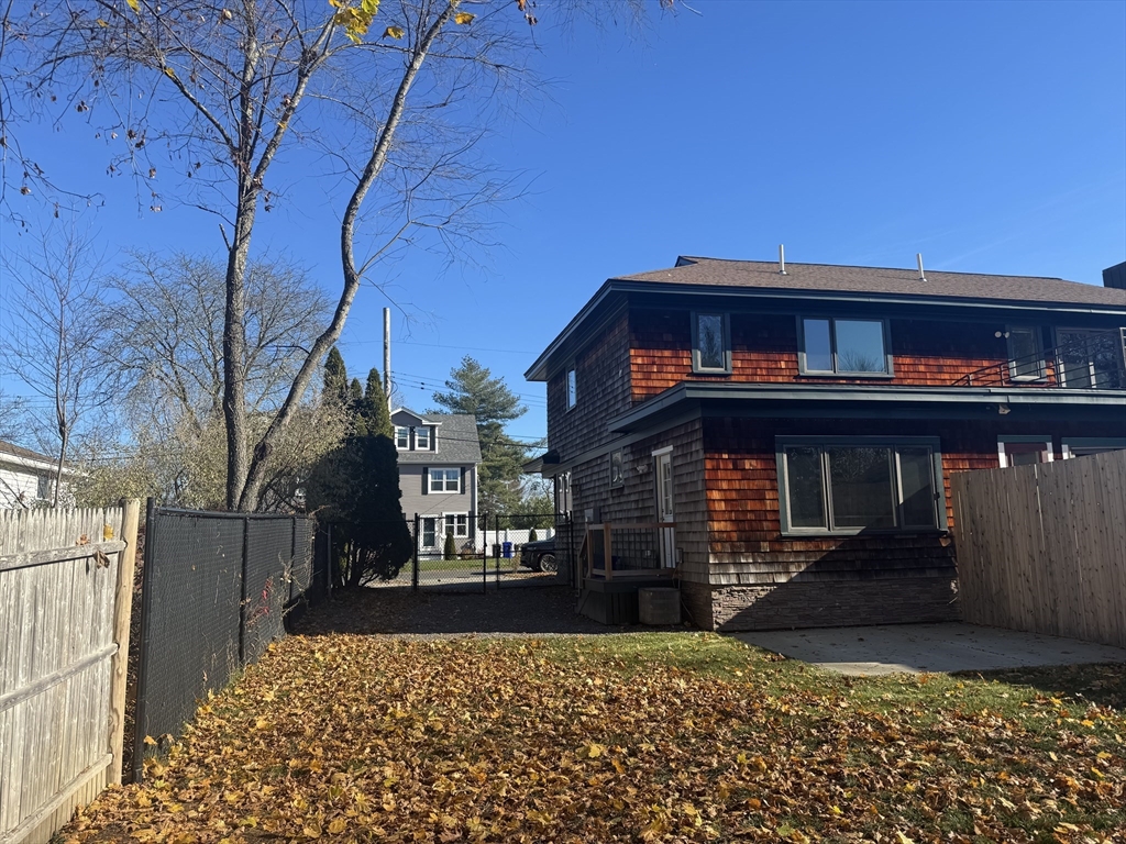 39 Neillian Street, Unit 39 Bedford, MA 01730 - Photo 27 of 29 a view of a house with a small yard