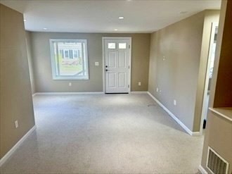 39 Neillian Street, Unit 39 Bedford, MA 01730 - Photo 7 of 29 an empty room with windows and closet