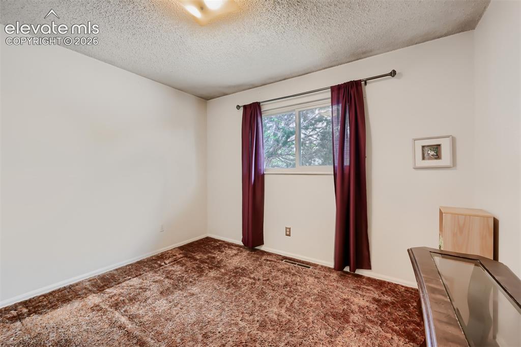 4618 Ridgeglen Road Colorado Springs, CO 80918 - Photo 14 of 27 Main floor bedroom
