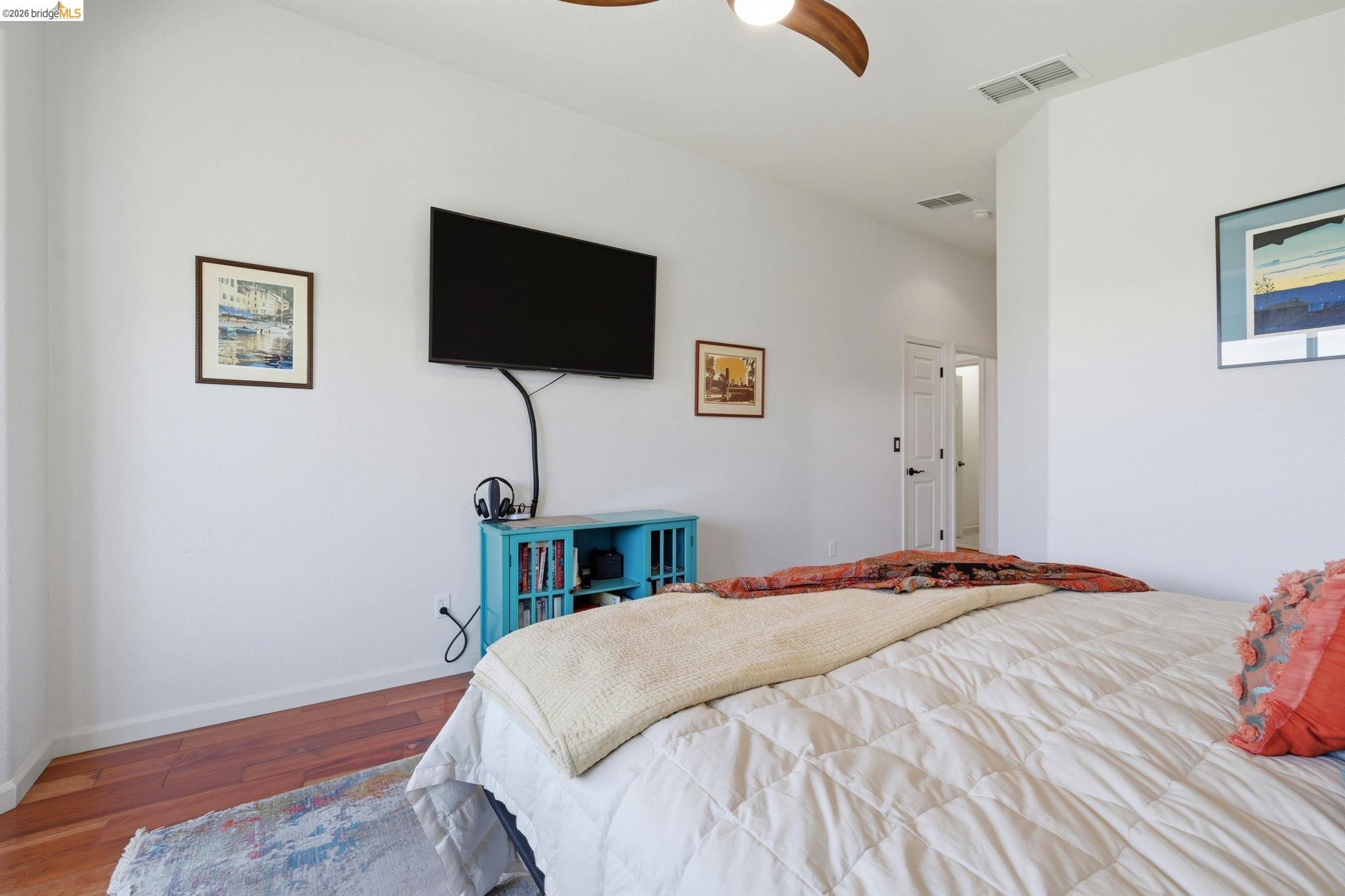 1024 Diamante Rio Vista, CA 94571 - Photo 16 of 27 Bedroom featuring wood-finish flooring, white walls, and a ceiling fan