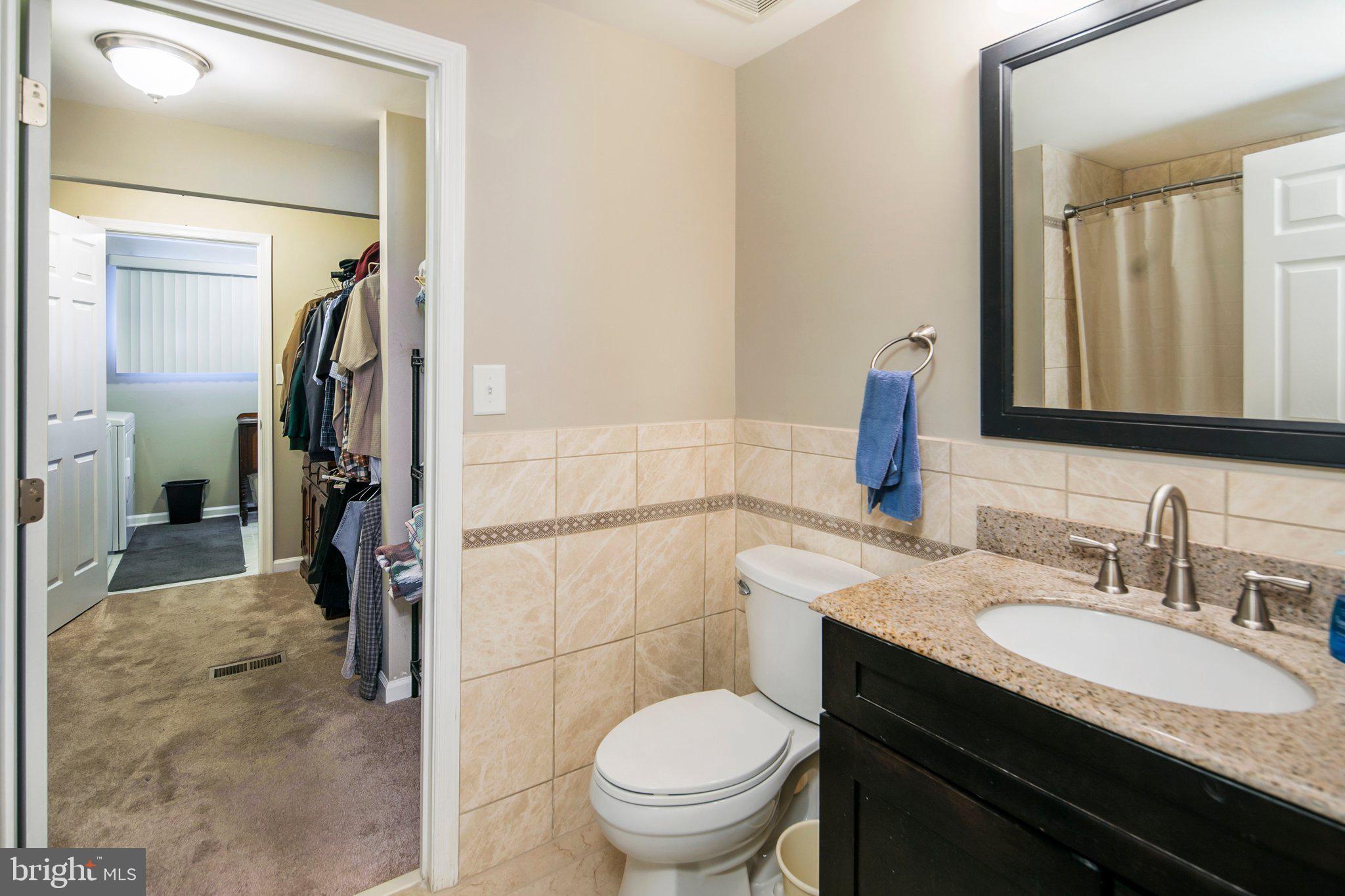 176 Chelsea Road Pasadena, MD 21122 - Photo 12 of 25 Primary Bedroom Ensuite Full Bathroom