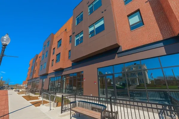 a view of building with glass door
