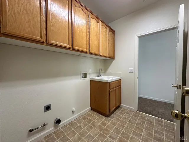 a utility room with cabinets