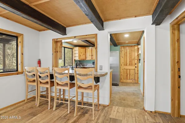 a dining room with furniture and window