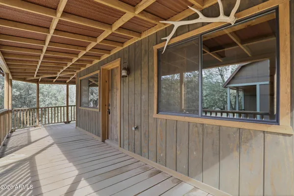 a view of a balcony with wooden floor