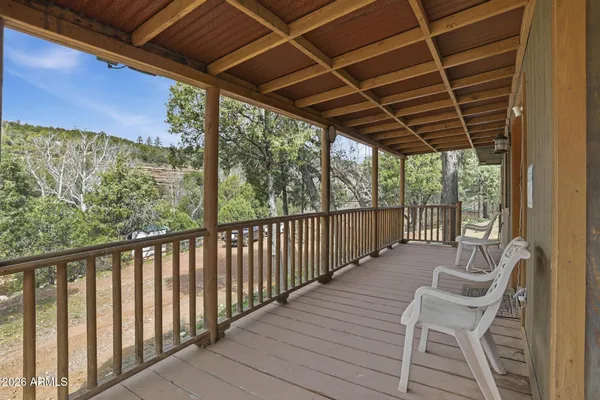 a view of a two chairs in the balcony
