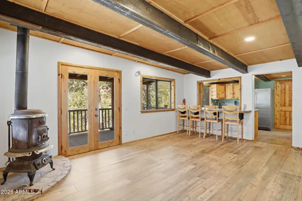 a view of a livingroom with furniture and a window