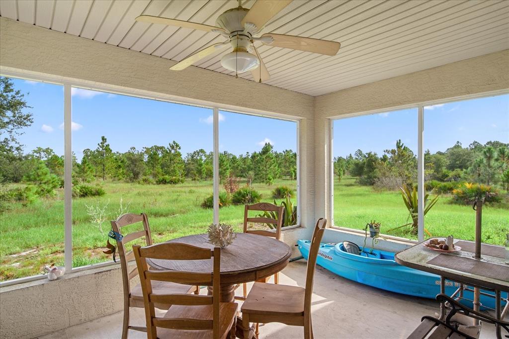 30 Milky Way Venus, FL 33960 - Photo 8 of 47 a view of a chairs and table in patio with a yard