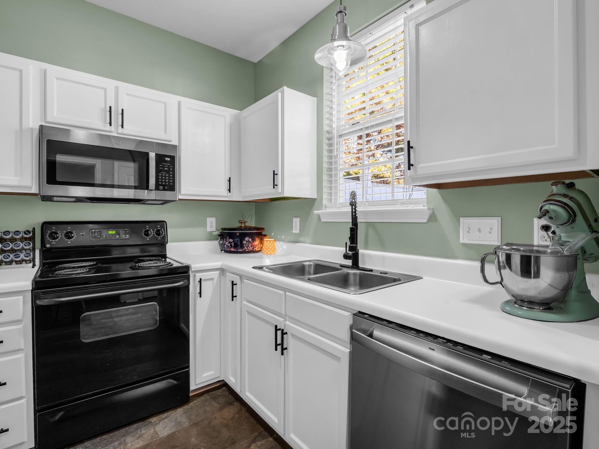 6103 Dane Drive Dallas, NC 28034 - Photo 12 of 29 a kitchen with appliances a sink and cabinets