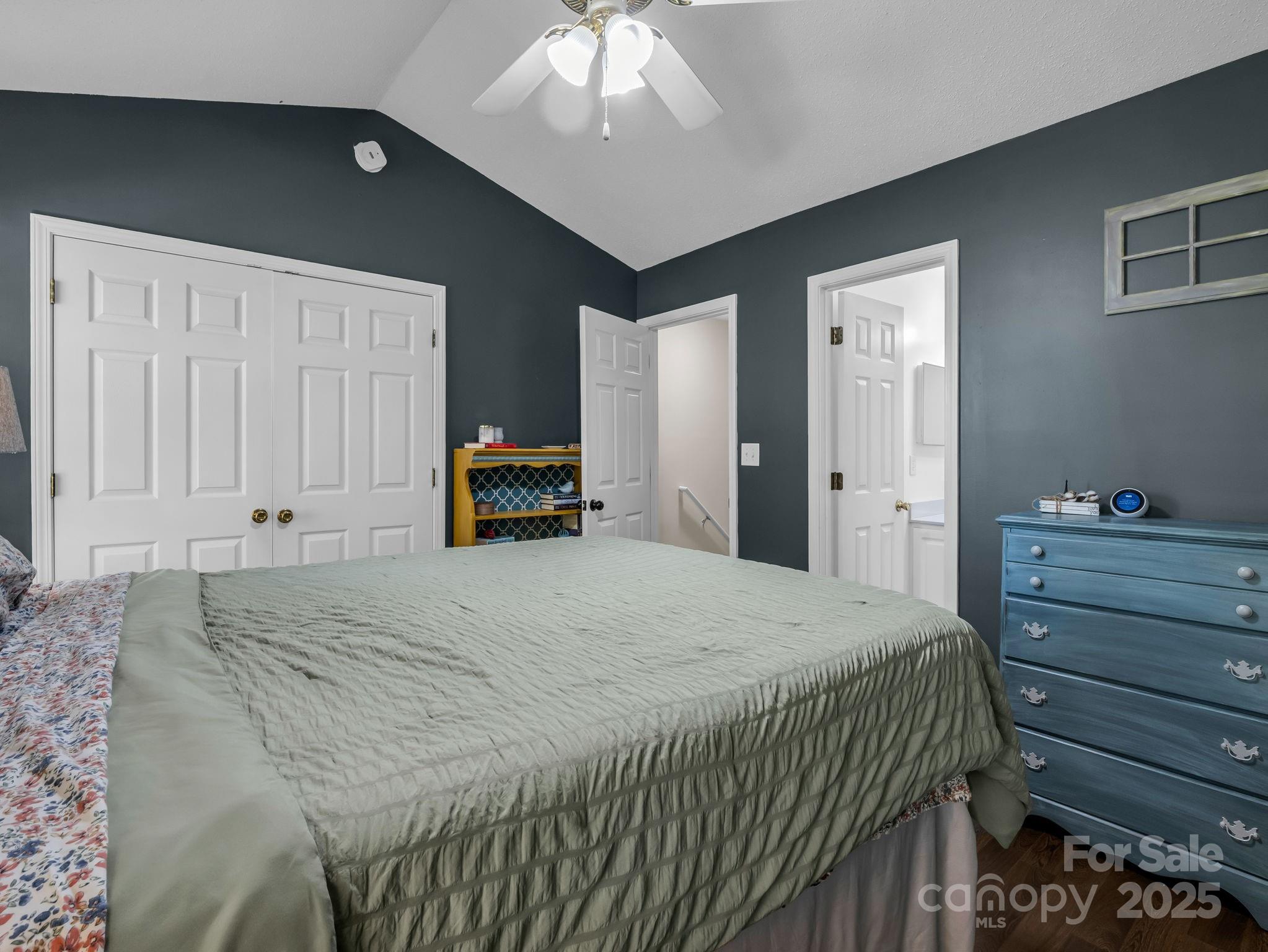 6103 Dane Drive Dallas, NC 28034 - Photo 17 of 29 a bedroom with a bed and a chandelier