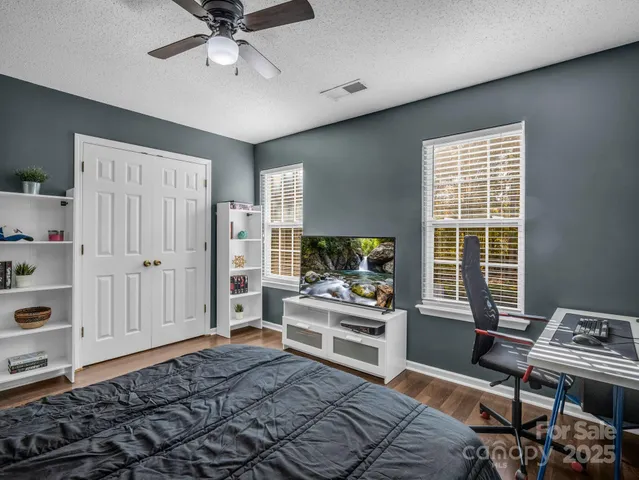a bedroom with furniture and a window