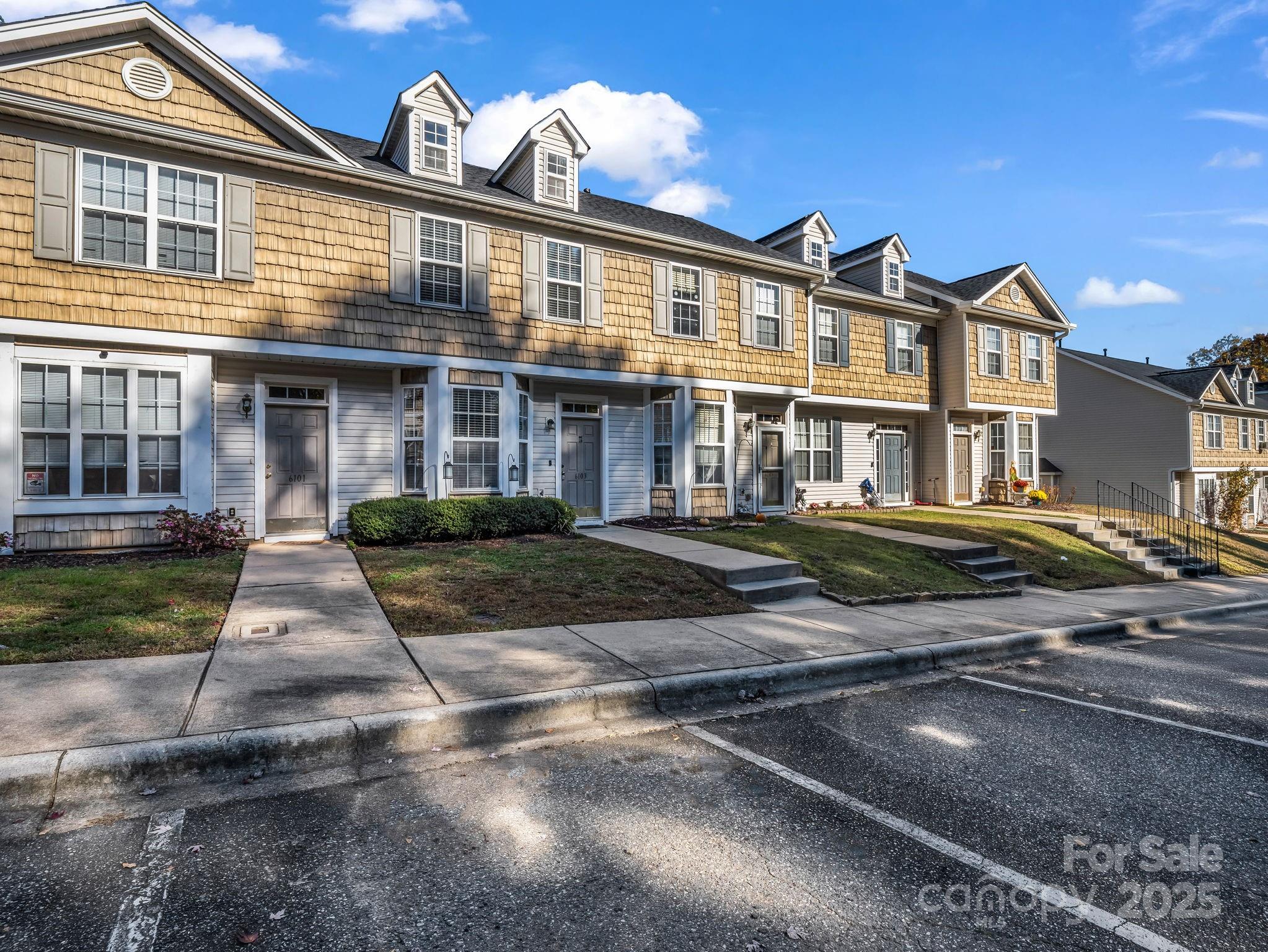 6103 Dane Drive Dallas, NC 28034 - Photo 25 of 29 a front view of a house with yard and parking