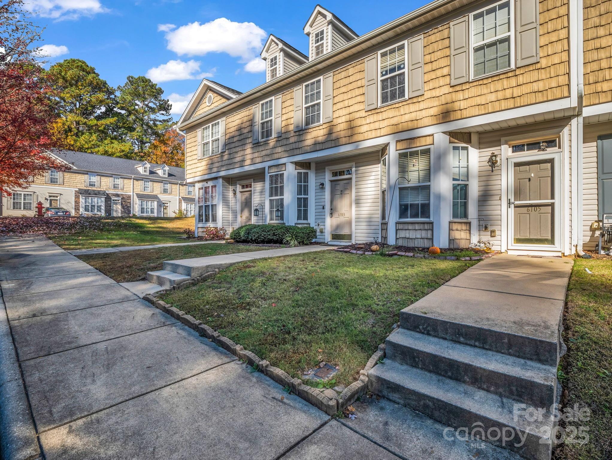 6103 Dane Drive Dallas, NC 28034 - Photo 26 of 29 front view of a brick house with a yard