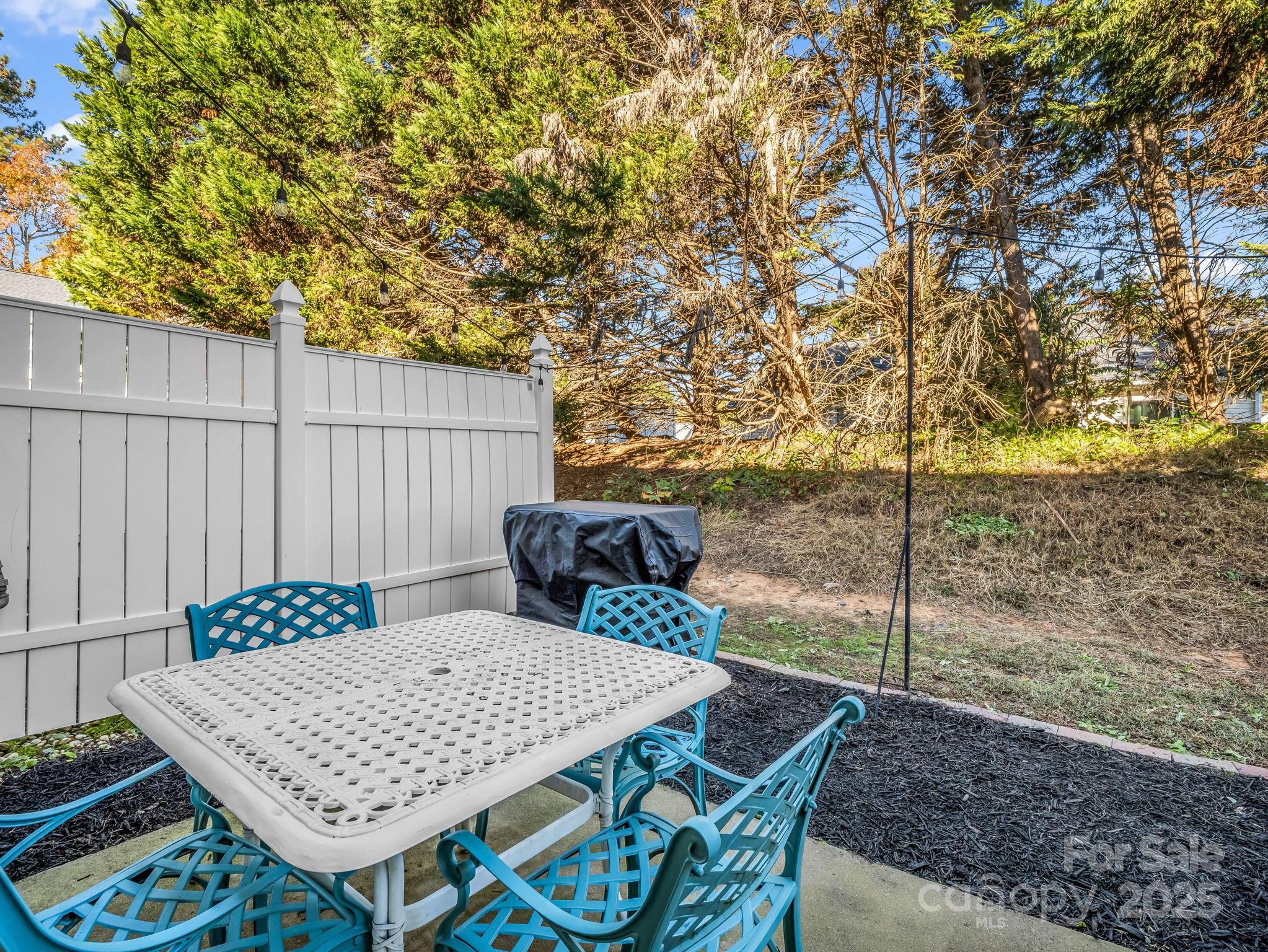 6103 Dane Drive Dallas, NC 28034 - Photo 28 of 29 a view of a patio with table and chairs