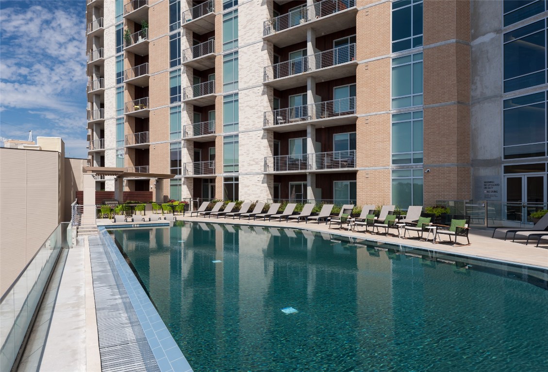 214 Barton Springs Road, Unit 922 Austin, TX 78704 - Photo 17 of 20 a house with swimming pool in front of it