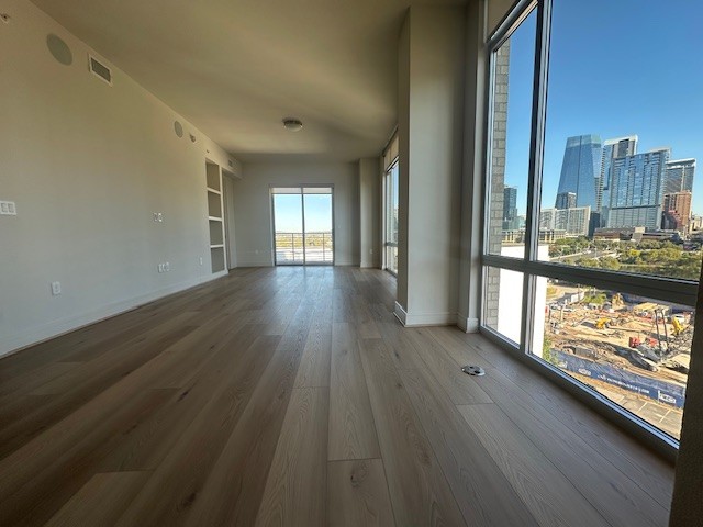 214 Barton Springs Road, Unit 922 Austin, TX 78704 - Photo 3 of 20 a view of a room with wooden floor and a window