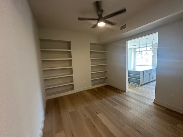 214 Barton Springs Road, Unit 922 Austin, TX 78704 - Photo 8 of 20 a view of a room with wooden floor closet and windows